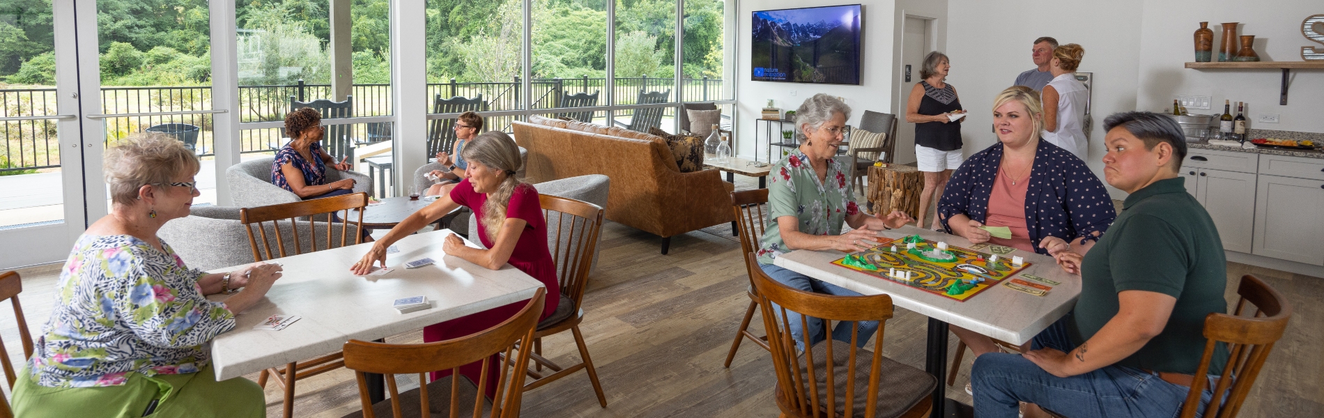 Residents gather in the clubhouse at The Hamlet to play games and enjoy each other's company.