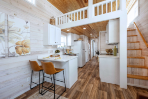 Grande tiny home kitchen and loft staircase.