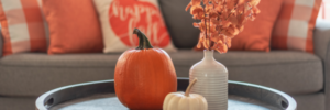 Autumn cottage home decor centerpiece with pumpkins.