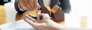 Purchasing a home and receiving the key.