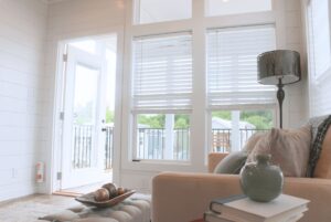 Sunset Retreat tiny home living area with floor to ceiling windows.