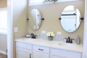 Sunset Retreat tiny home bathroom with double sink vanity.