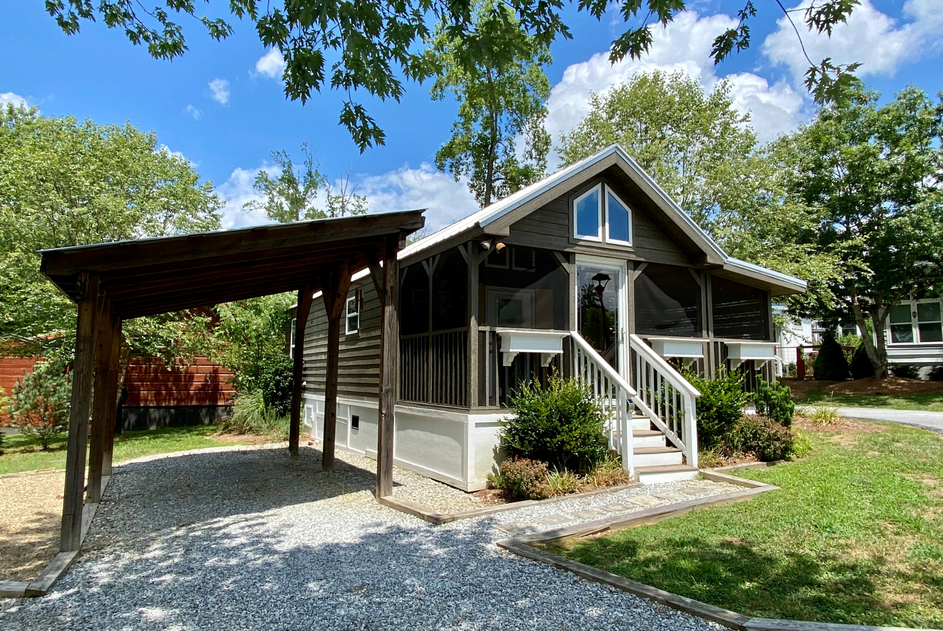 Tiny home view from the street. 2-car parking with carport.