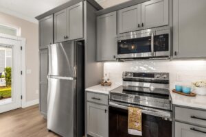 kitchen appliances stainless steal included with cottage home in lakeshore by simple life