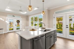 kitchen island and open floorplan in cottage home new built near the villages fl