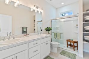 owner bedroom with double sink vanity