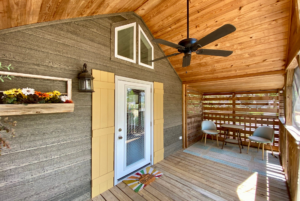 Covered and screened -in front porch with added deck space.