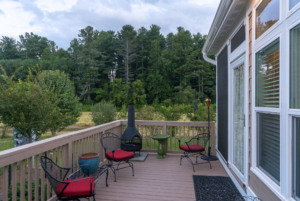 Tiny home side deck with nature preserve views.