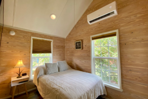 Tiny home bedroom with large windows