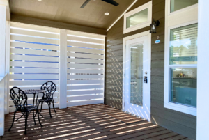 Nice covered porch with ceilling fan and privacy blinds