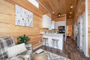 Zion tiny home interior with warm yellow pine shiplap walls.