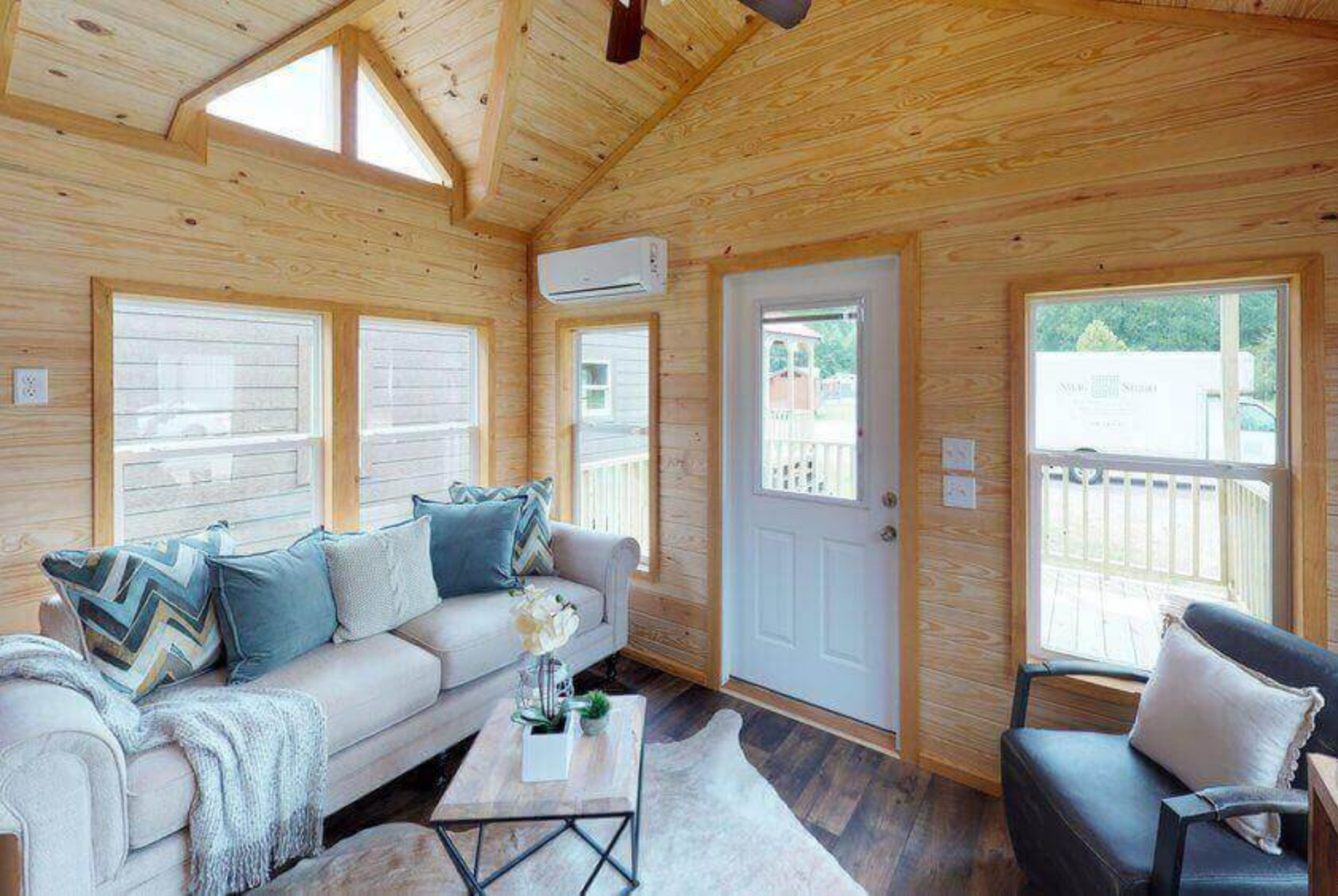 Echoe tiny home living room with shiplap walls.