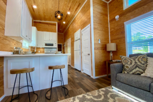 kitchen counter and breakfast space in tiny home located in the hamlet by simple life