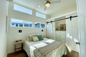 Bedroom with multiple windows and plenty of natural sunlight