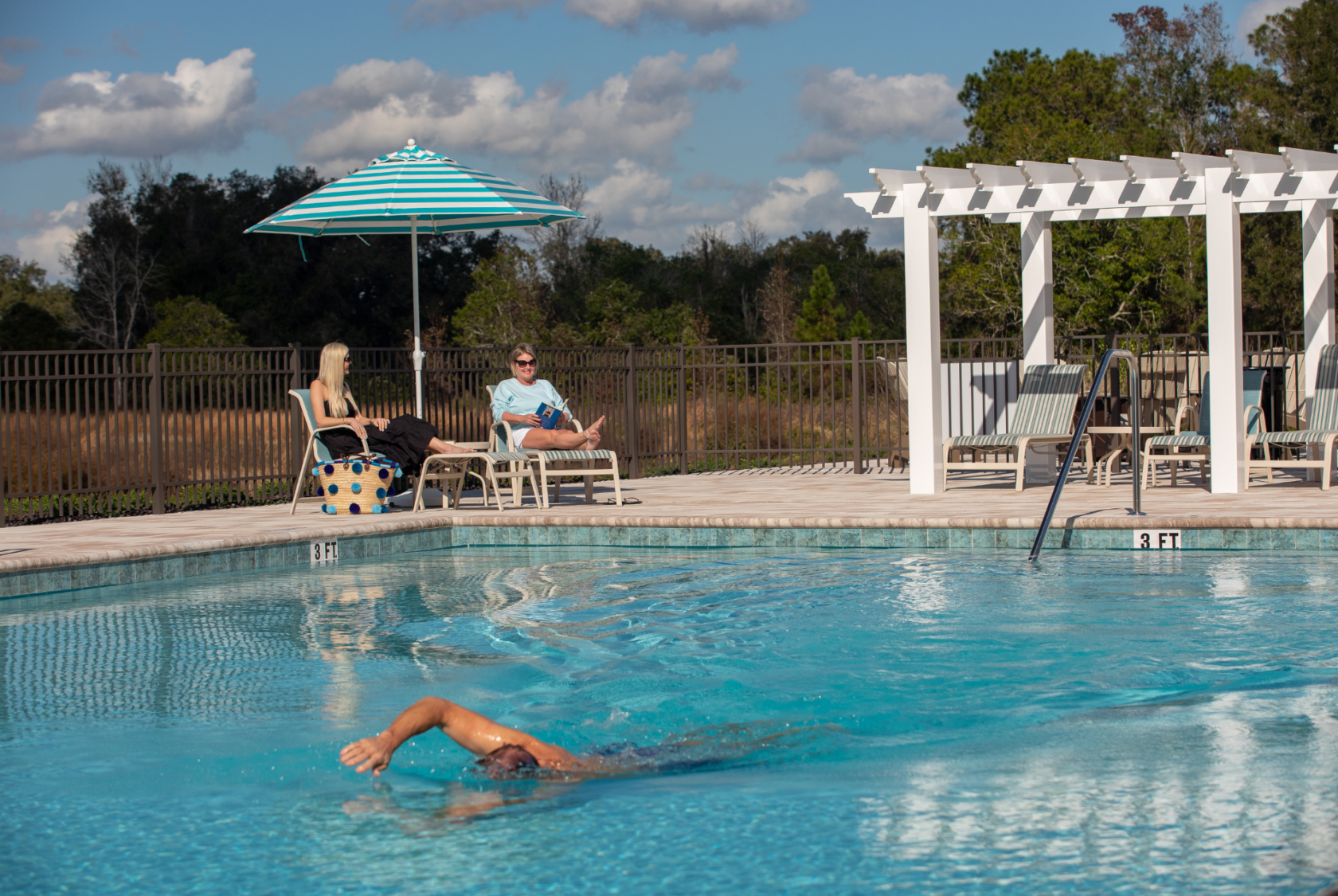 Residents enjoying the community pool at Lakeshore.