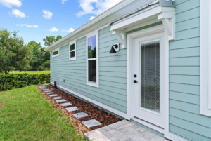 Side of small cottage home in Lakeshore by Simple Life located in Oxford FL