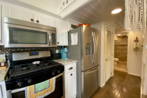 Full size appliances in tiny home kitchen