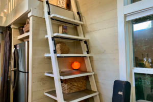 Stairs to loft space of tiny home that can also be used as storage.