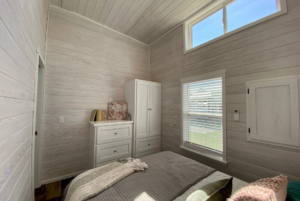 Bedroom with built-in storage including two dressers.