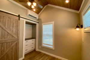 Main bedroom in the Swayback model by Clayton Park Model with built in storage