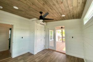 Second bedroom addition with large storage space and ceiling fan