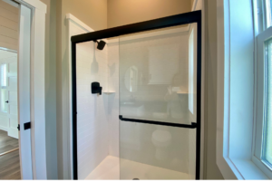 walk in shower located in the tiny home bathroom
