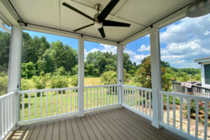 Covered porch tiny home with preserve view and ceilling fan.