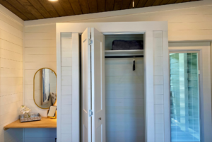 built-in closet in tiny home bedroom