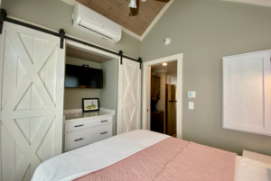 Bedroom closet with his and hers closet and built-in furniture