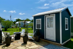 Tiny house offer different storage options with this added shed.