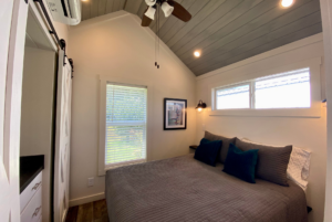 Bedroom with plenty of natural light, high ceillings and celling fan