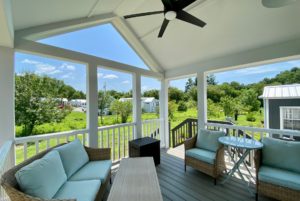 This large covered porch comes with a perfect view and ceilling fan.