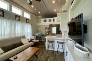 This beautiful tiny house includes a loft and high ceilling.