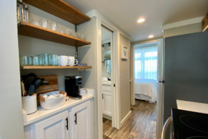 Tiny home with plenty of kitchen storage including a coffee nook.