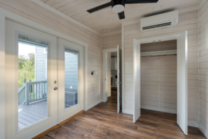 Bedroom storage with closet doors open.