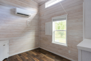 Bedroom with windows and plenty of natural light.