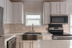 Kitchen with appliances, island and full size appliances.