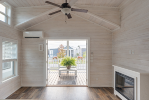 Living space with french doors open to large covered porch.