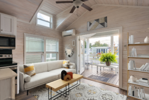 Living room with staged furniture and decor to show the space's potential.