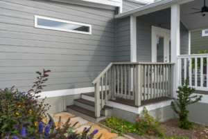 Small amount of stairs leading to tiny home entrance.