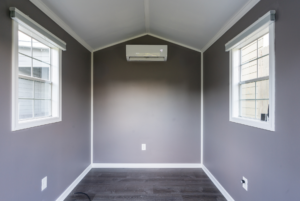 Finished shed with ample natural light coming from both windows.