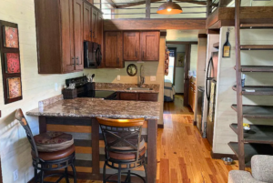 kitchen of park model home with loft