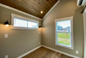 bedroom with large windows and high ceillings