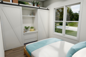 bedroom with built-in storage and transiant window