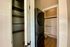 This tiny home has plenty of storage with a full size pantry