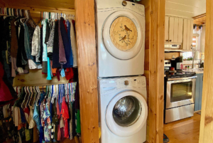 washer anddryer in tiny home with closet space