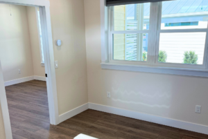 Large window in living room of cottage home