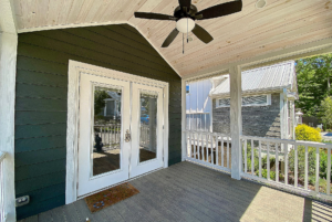 Covered front porch with french doors and ceilling fan