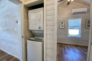 Stackable washer/dryer unit in tiny home for sale