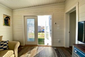 Second bedroom in tiny home with access to outdoor with french doors